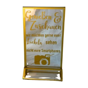 Schild "Genießen und Zuschauen - wir möchten gerne euer Lächeln sehen, nicht eure Smartphones"